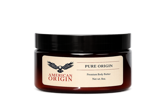 A jar of American Origin Pure Origin Premium Body Butter with a black lid and a beige label, set against a plain white background.